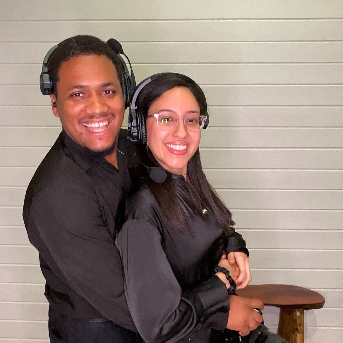 Justo and Maria Peña on headsets during a wedding