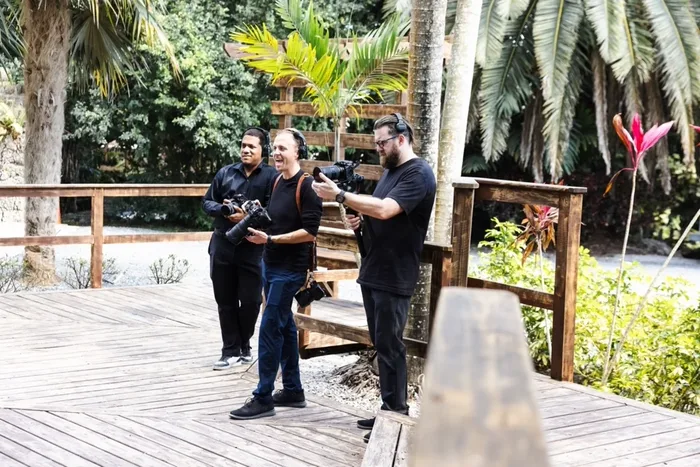 The Solfilms crew of three operators shooting on a garden deck