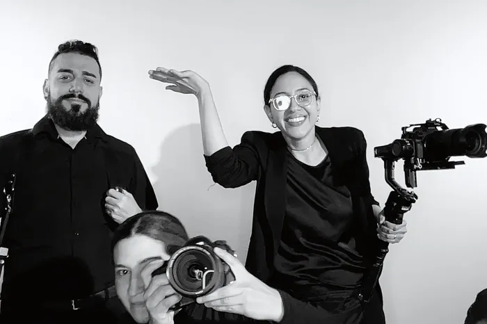 Crew clowning with a gimbal rig in frame